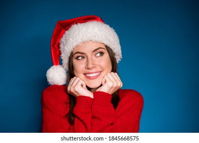 Close up photo positive girl in santa claus hat touch face fists chin guess boyfriend give x-mas christmas fair party celebrate wear pullover isolated gradient blue color background - Powered by Shutterstock