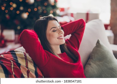 Close up photo of positive girl sit divan stretch hands x-mas christmas rest relax concept in house indoors