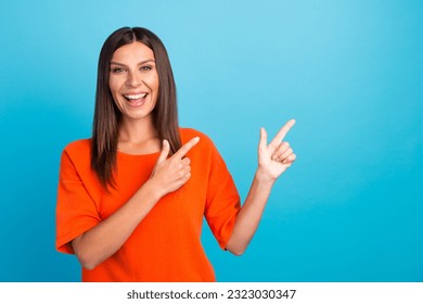 Close up photo of pretty cheerful lady stylish orange clothes arm direct empty space beauty procedure isolated on color background.