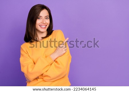 Close up photo of pretty cheerful lady stylish orange clothes arm direct empty space beauty procedure isolated on purple color background