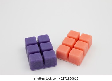 Close Up Photo Of Purple And Pink Sugar Scrub On The White Background 