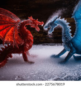 Close up photo of a red dragon fighting an ice dragon