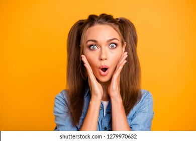 Close Up Photo Of Shocked Amazing Brunette She Her Lady Pretty Hairdo Hands On Cheeks Cheekbones Oh My God Expression Wearing Casual Jeans Denim Shirt Outfit Isolated On Yellow Background