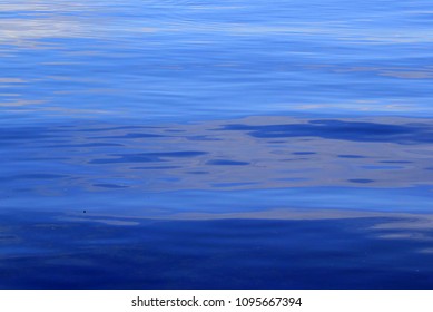 Close Up Photo Of Soft, Deep Blue Ocean Water That Looks Like A Watercolor Painting Taken At Sarasota, Florida Bay For Background Texture.