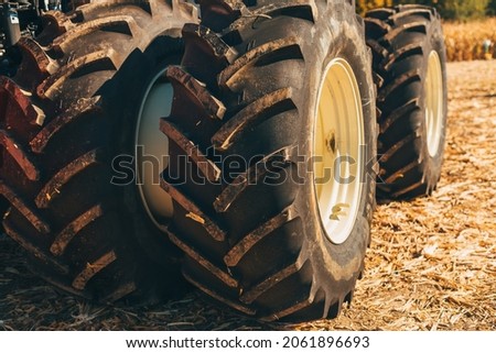 Close up photo of some tractor tires or wheels. Photo made on a sunny day.