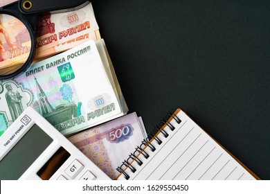 Close up photo of stack of Russian money rubles with calculator