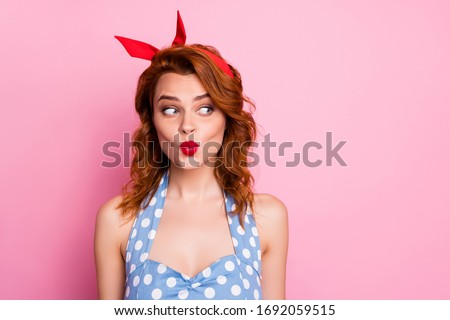 Close up photo of sweet lovely girl woman look copyspace send air kiss plan tricky things wear blue polka-dot outfit isolated over pastel pink color background