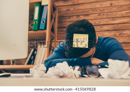 Close up photo of tired man having long working day and needing help