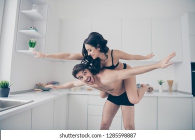 Close up photo of two people pair she her lady he him his piggyback hold childish morning together play pretending plane wings like bird lovely looking adorable funny funky free time leisure rejoice
