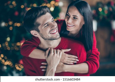 Close up photo of two people romantic dreamy man and woman hug  gently piggyback in house with newyear decoration lights indoors enjoy christmas vacation x-mas holidays - Powered by Shutterstock