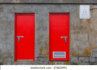 Close Up Photo Of Two Red Warehouse Door