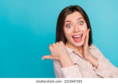 Close Up Photo Of Winsome Young Woman Point Excited Empty Space Dressed Stylish Smart Casual Look Isolated On Aquamarine Color Background