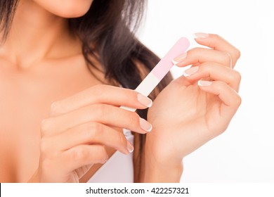 Close Up Photo Of Woman Doing Manicure With Nail File