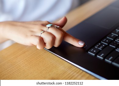 Close up photo of woman touching laptop fingerprint sensor with her finger to log in into system. Biometric fingerprint print scan provides security access with user identification. Computer privacy - Powered by Shutterstock