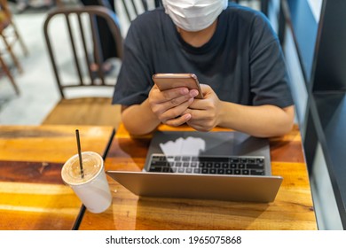 Close Up Photo Of Woman Wearing Medical Mask While Sitting At Coffeeshop