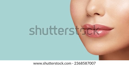 Close up photo of women lips. Cosmetology beauty injetion procedure. Hyaluronic acid. Lip protection balm. Hygienic lipstick [[stock_photo]] © 
