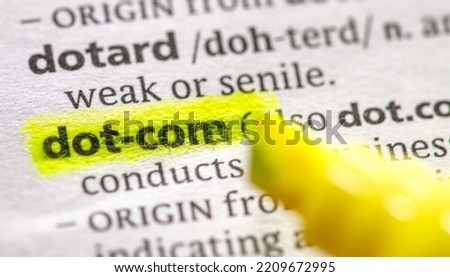 Close up photo of the word dot com in a dictionary book