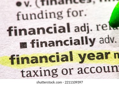 Close Up Photo Of The Words Financial Year In A Dictionary Book