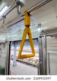 Close Up Photo Of Yellow Strap In A Train