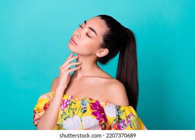 Close Up Photo Of Young Chinese Lady Apply Skin Product Cream Touch Neck Wear Stylish Colorful Garment Isolated On Cyan Color Background