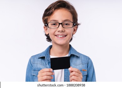 Close Up Photo Of Young White Boy Holding Credit Card Isolated Over White Background