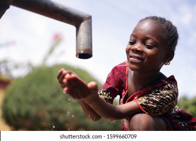 Close Up Photograph Of African Black Girl Drinking Safe Water From Tap