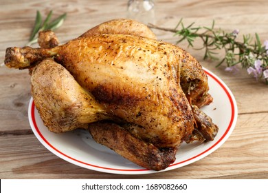 Close Up Photograph Of A Good Chicken Cooked On A Spit.