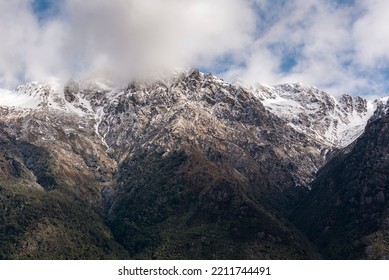 Close Up Photograph Of Majestic Snow Capped Mountains That Surrounds Queenstown, New Zealand On A Foggy Morning 