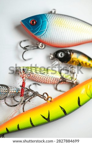 Close up photograph of multi colored plastic fish baits prepared for freshwater angling session