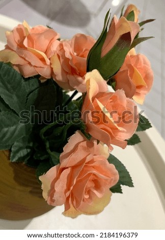 Close up picture of artificial orange flower
