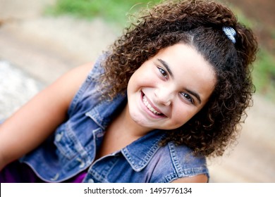 Close Up Picture Of Beautiful Biracial African American Black Tween Girl Outdoor At Nature Park In The Summer