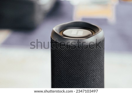 Close up picture of a black speaker at home