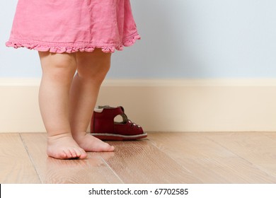 Close Up Picture Of Cute Baby Legs In A Room