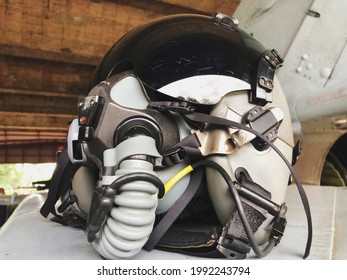 Close Up Picture Of Fighter Pilot Helmet Used For Flying Military Aircraft. Oxygen Mask And Radio Communication Device For Talking To Air Traffic Control.