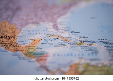 Close Up Picture Focused On Cuba On A Colorful Map Of The Lucayan Archipelago With Its Main Routes Marked In Red And With The Rest Of The Countries And Islands Blurred Out