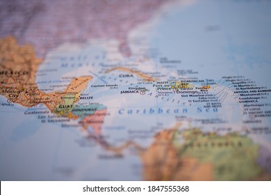 Close Up Picture Focused On Jamaica On A Colorful Map Of The Lucayan Archipelago With Its Main Routes Marked In Red And With The Rest Of The Countries And Islands Blurred Out