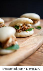 Close up picture of Japanese bao stuffed with stewed beef and mint