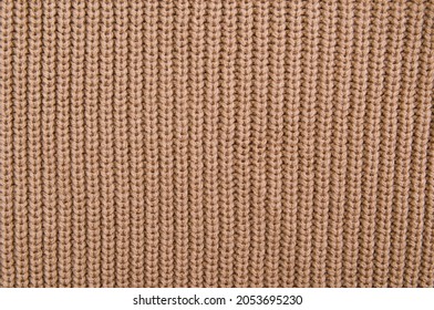 Close Up Picture Of Knitted Pattern, Beige Woolen Sweater Texture. 



