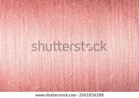 Close up picture of pastel pink thread texture, soft color background image