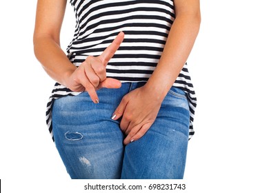 Close Up Picture Of Young Female With Bladder Control Problems On Isolated Background