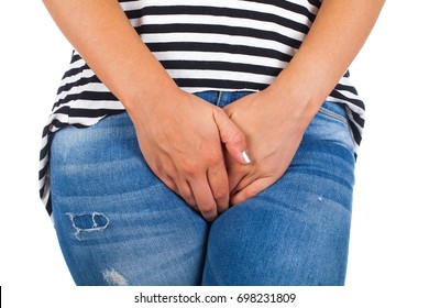 Close Up Picture Of Young Female With Bladder Control Problems On Isolated Background