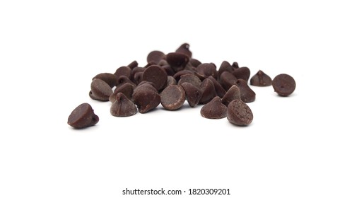 Close up pile of chocolate morsels on white background - Shutterstock ID 1820309201