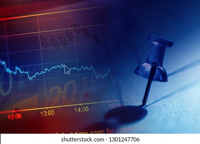 Close up of pin on graph data. Finance concept.
