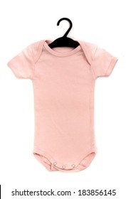 Close Up Of A Pink Baby Onesie On A Hanger Isolated 