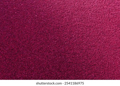 A close up of a pink background with a lot of small dots. The background is very bright and the dots are very small