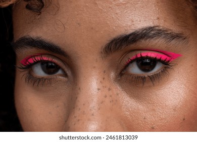 Close up of pink makeup on woman's eyes - Powered by Shutterstock