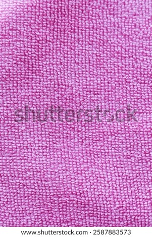 Close up of pink microfiber cloth texture. Abstract background.
