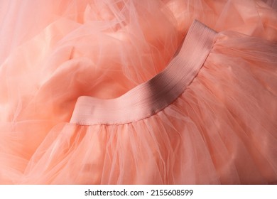 Close up of pink tulle skirt
				