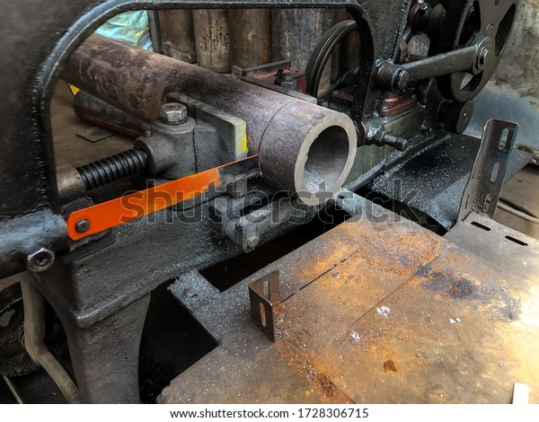 Close up of\
Pipe steel is being cut by the\
machine