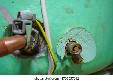 Close Up Of Pipes On A Hot Water Tank